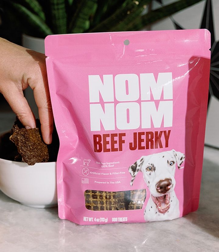 Some Beef Jerky treats spread out in front of their packaging