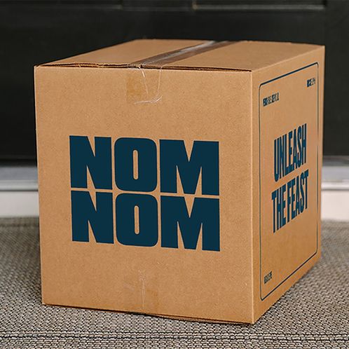 A packed shipping container of Nom Nom meals