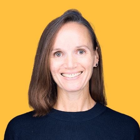 A woman hugs her dog